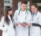 cheerful-group-medics-reading-papers-2048x1365