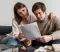 close-up-couple-reading-document-2048x1366