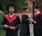 happy-indian-graduate-graduation-robe-holds-diploma-campus-2048x1365