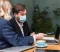 man-woman-talking-about-new-project-while-wearing-medical-masks-2048x1363